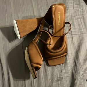 brown geometric/ triangular heels. never worn. size:6.5